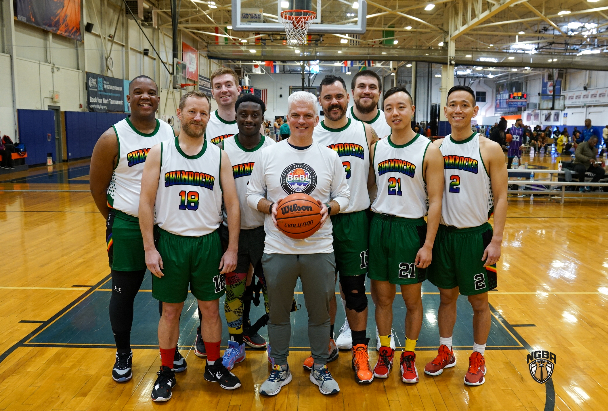 A basketball team poses for a group photo