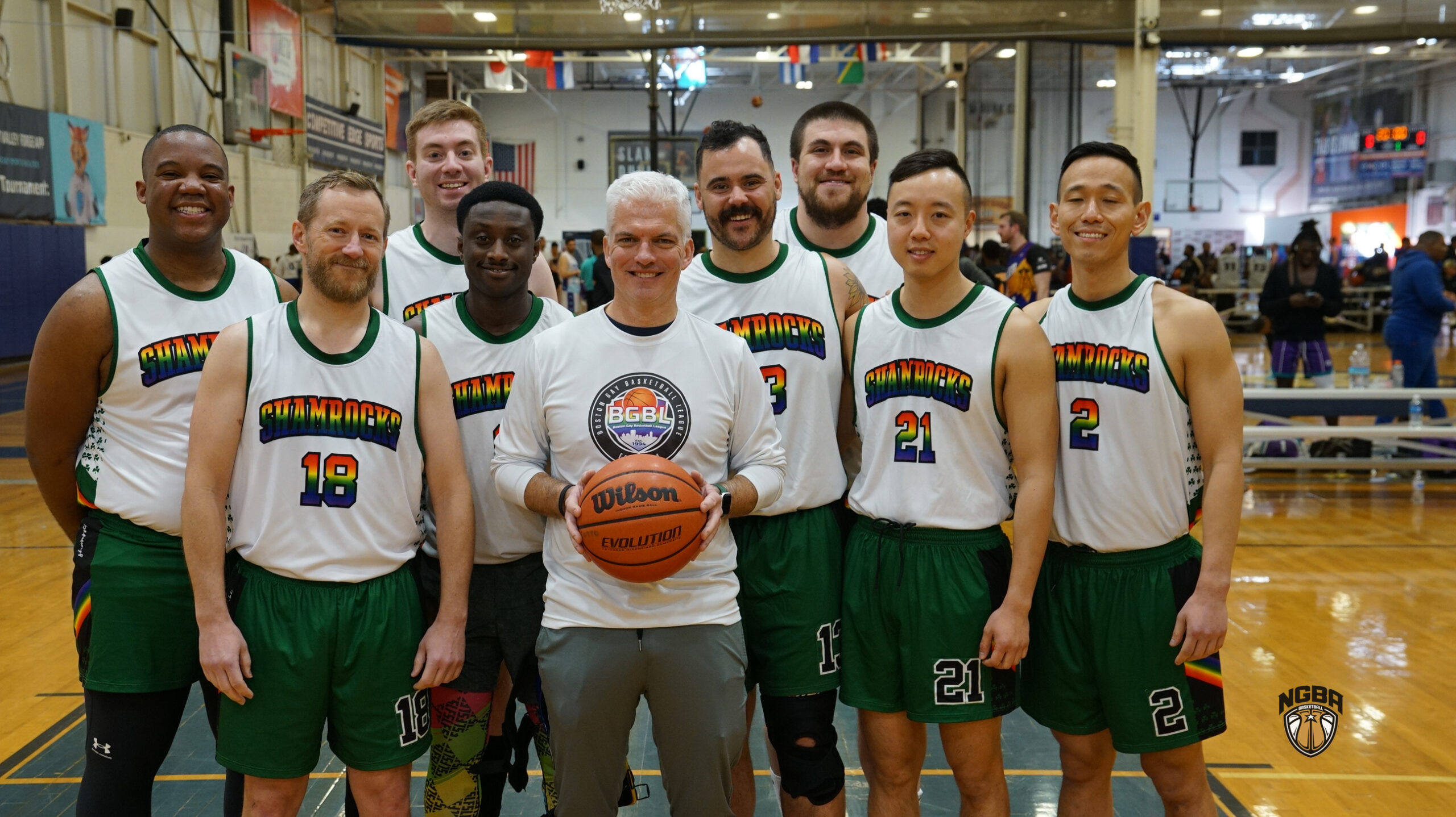 A basketball team poses for a group photo