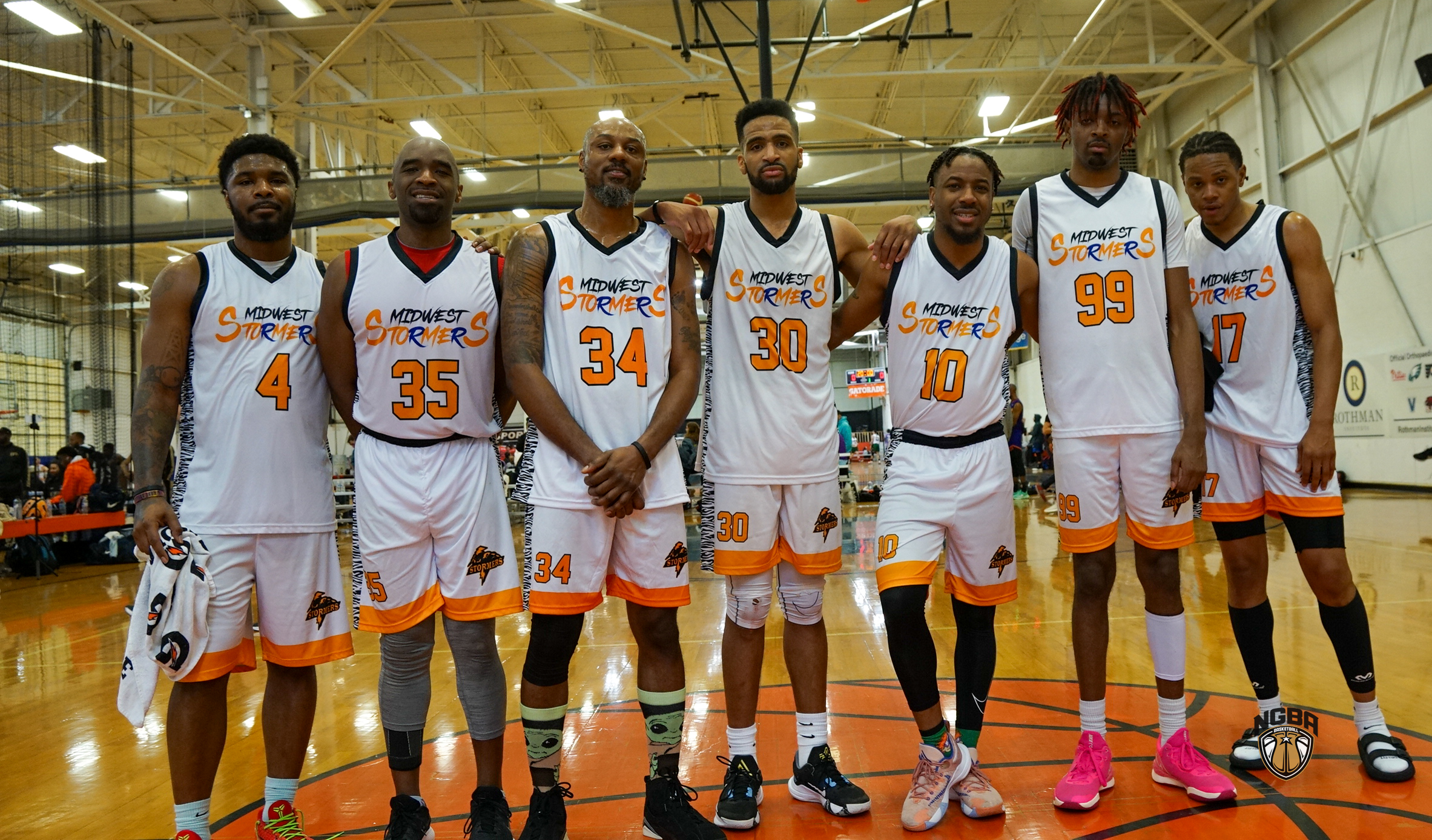 A basketball team poses for a group photo