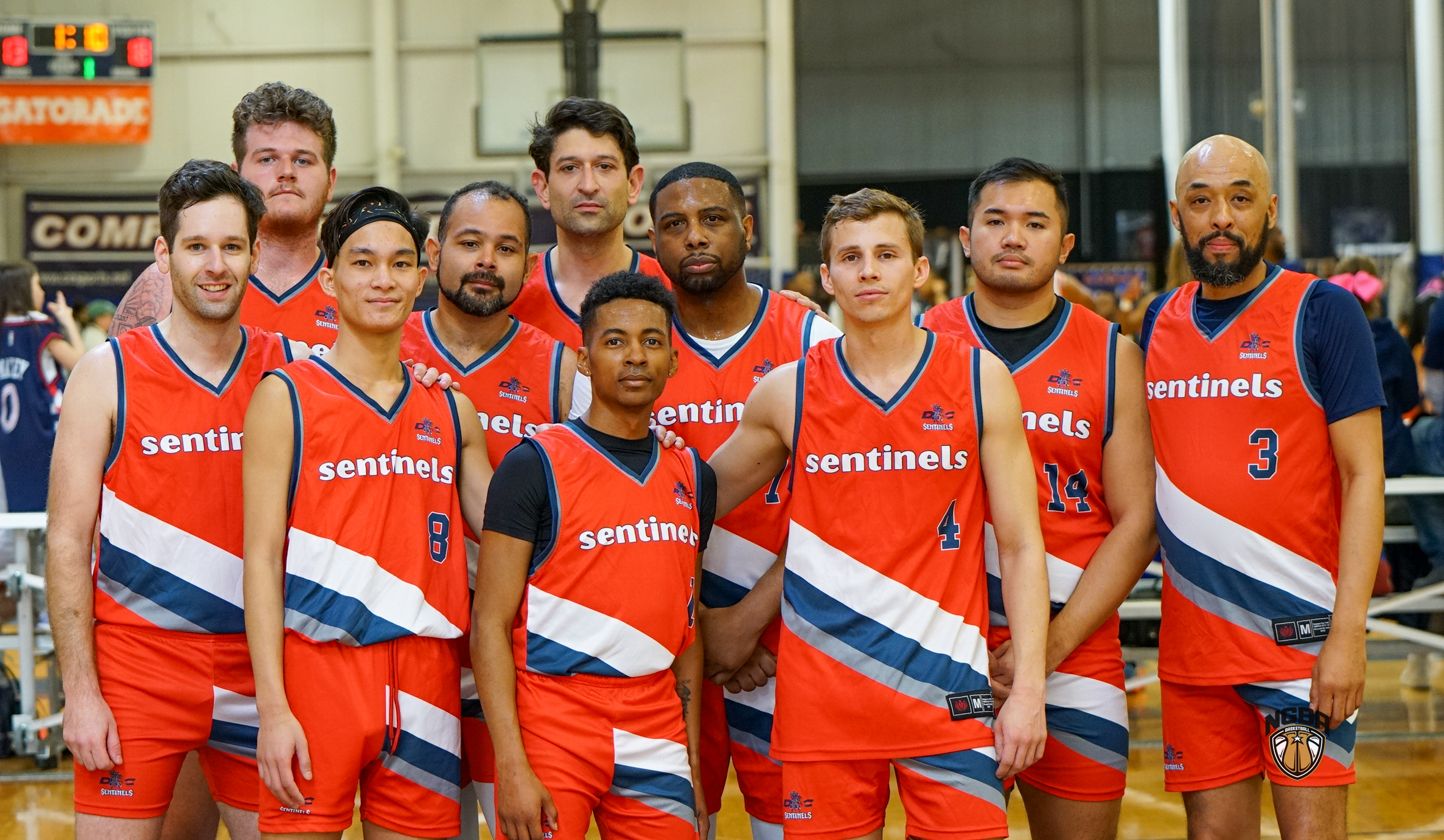 A basketball team poses for a group photo