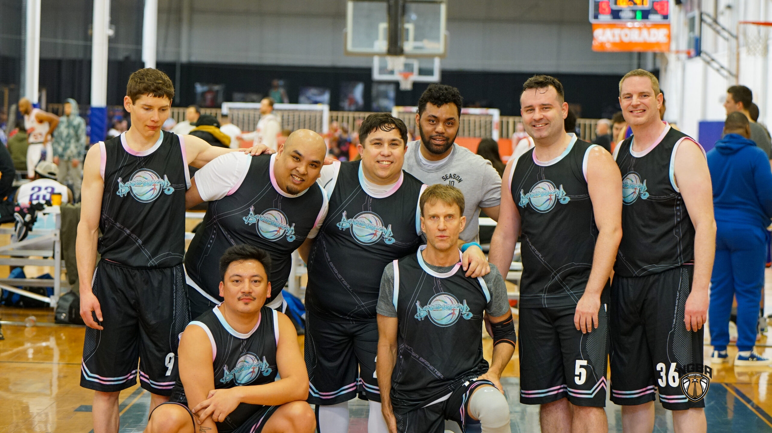 A basketball team poses for a group photo