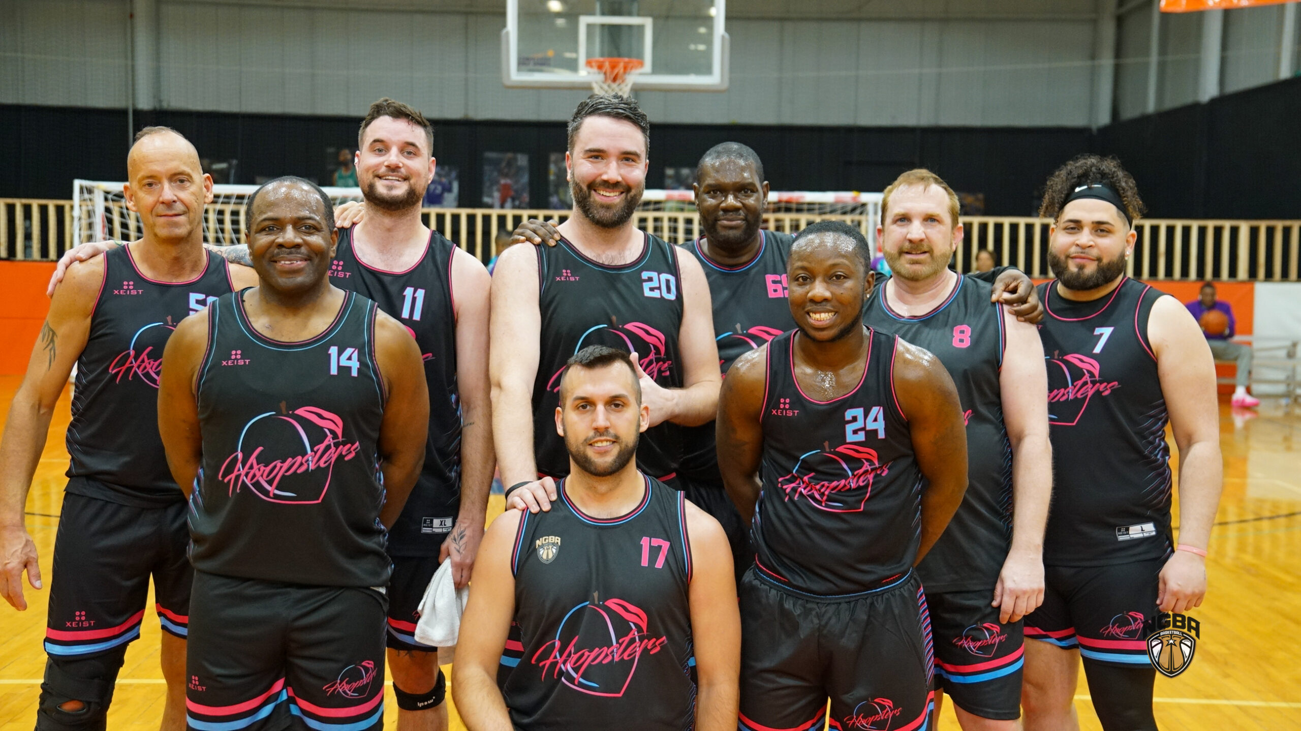 A basketball team poses for a group photo