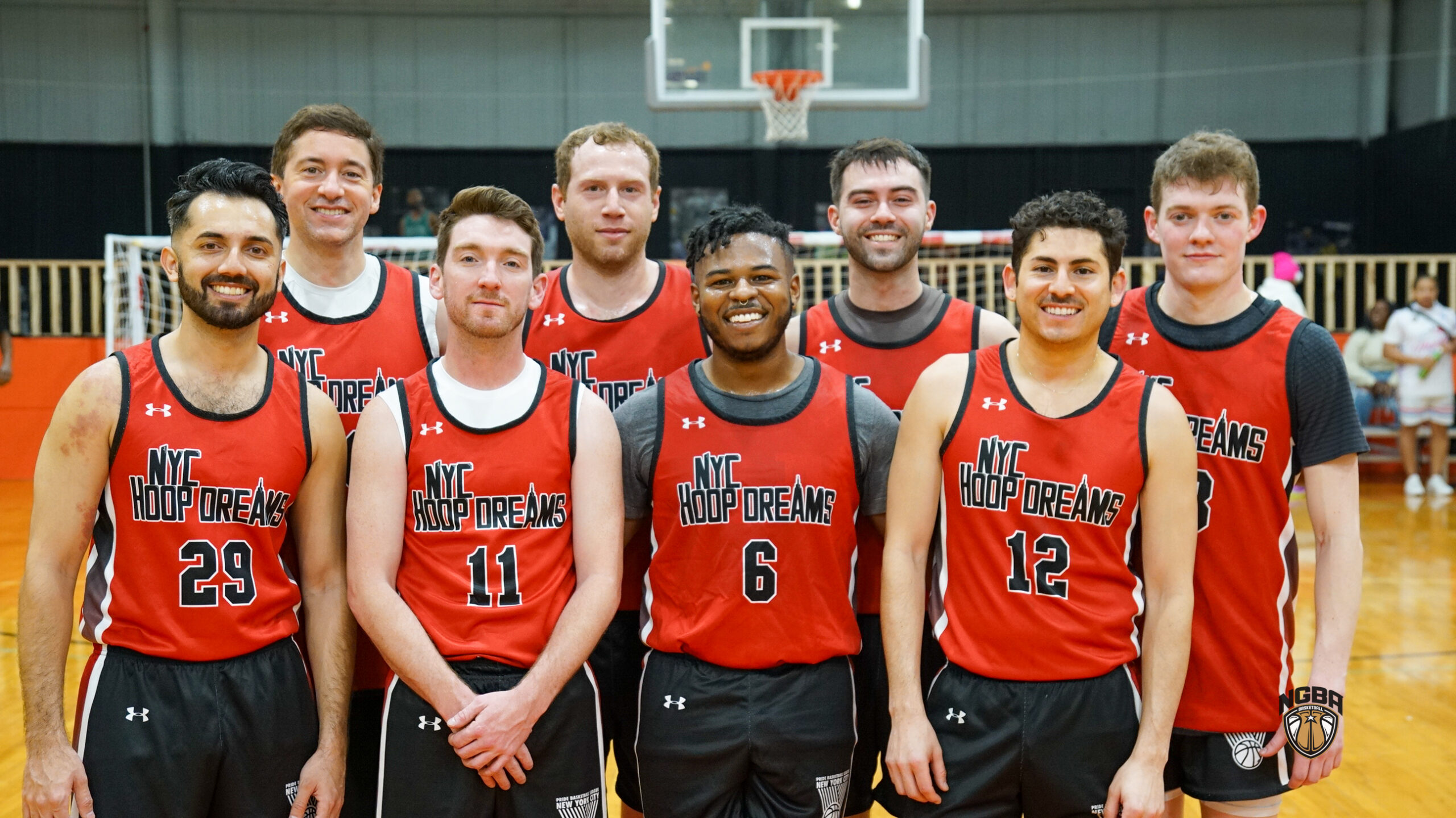 A basketball team poses for a group photo