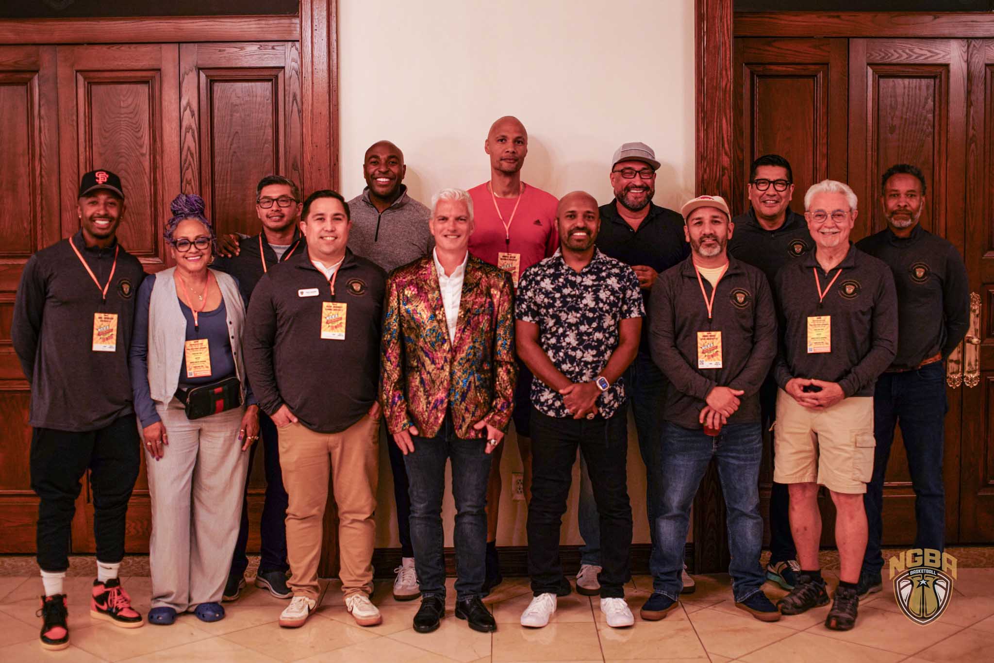 A group of people (NGBA Hall of Famers) smile for a photo