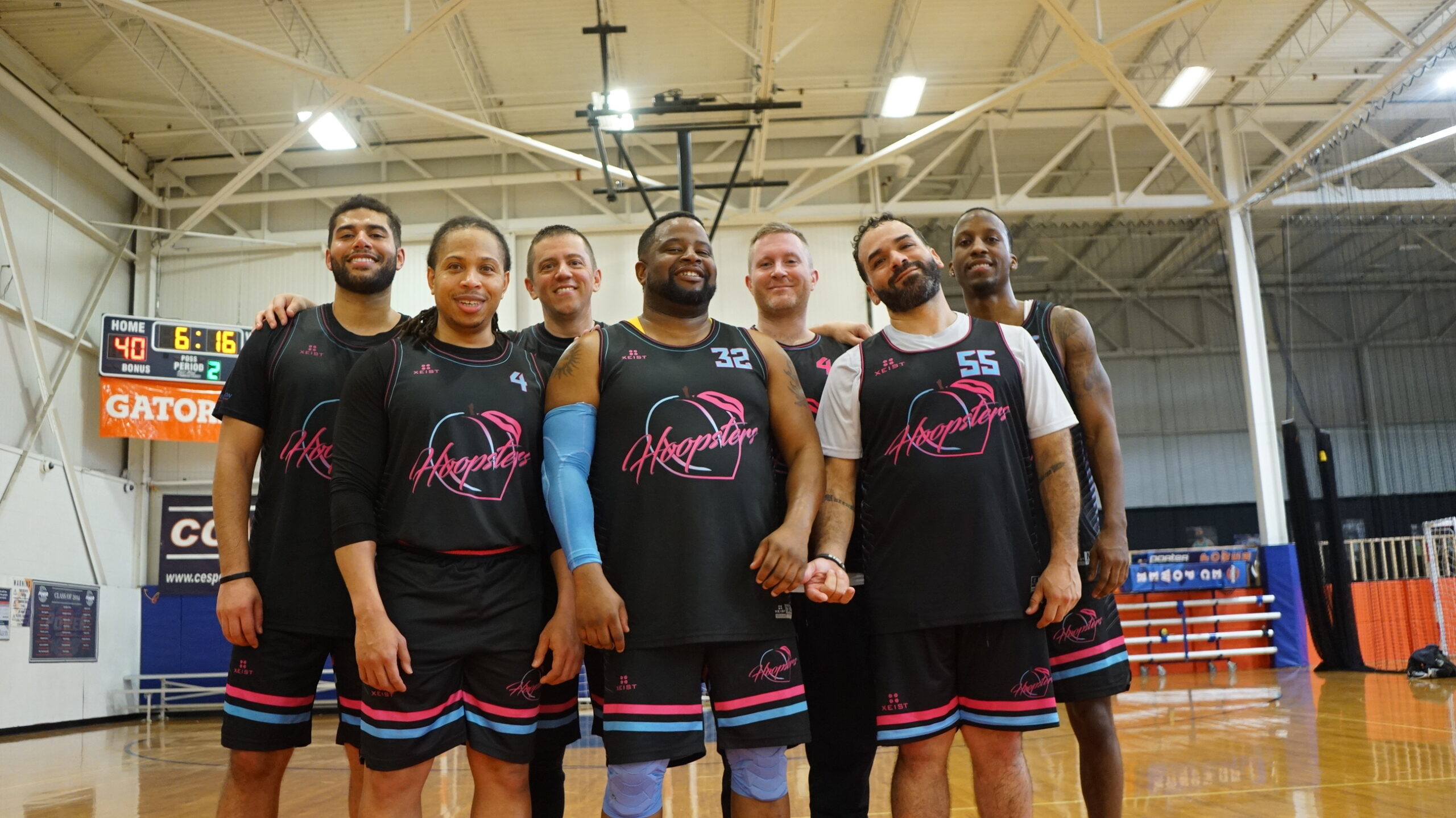 A basketball team poses for a group photo