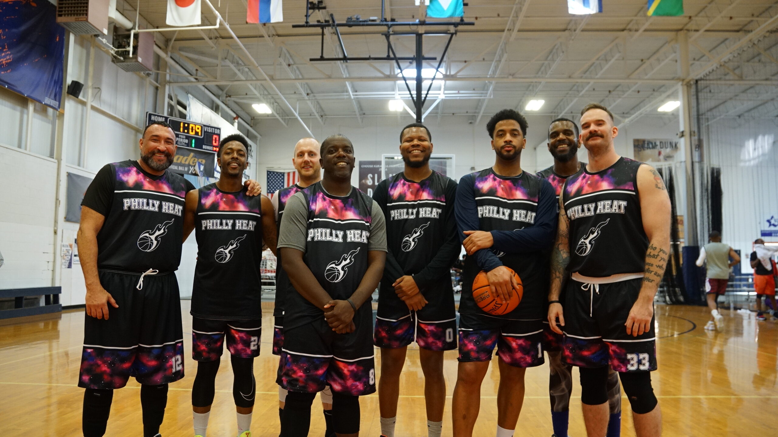 A basketball team poses for a group photo