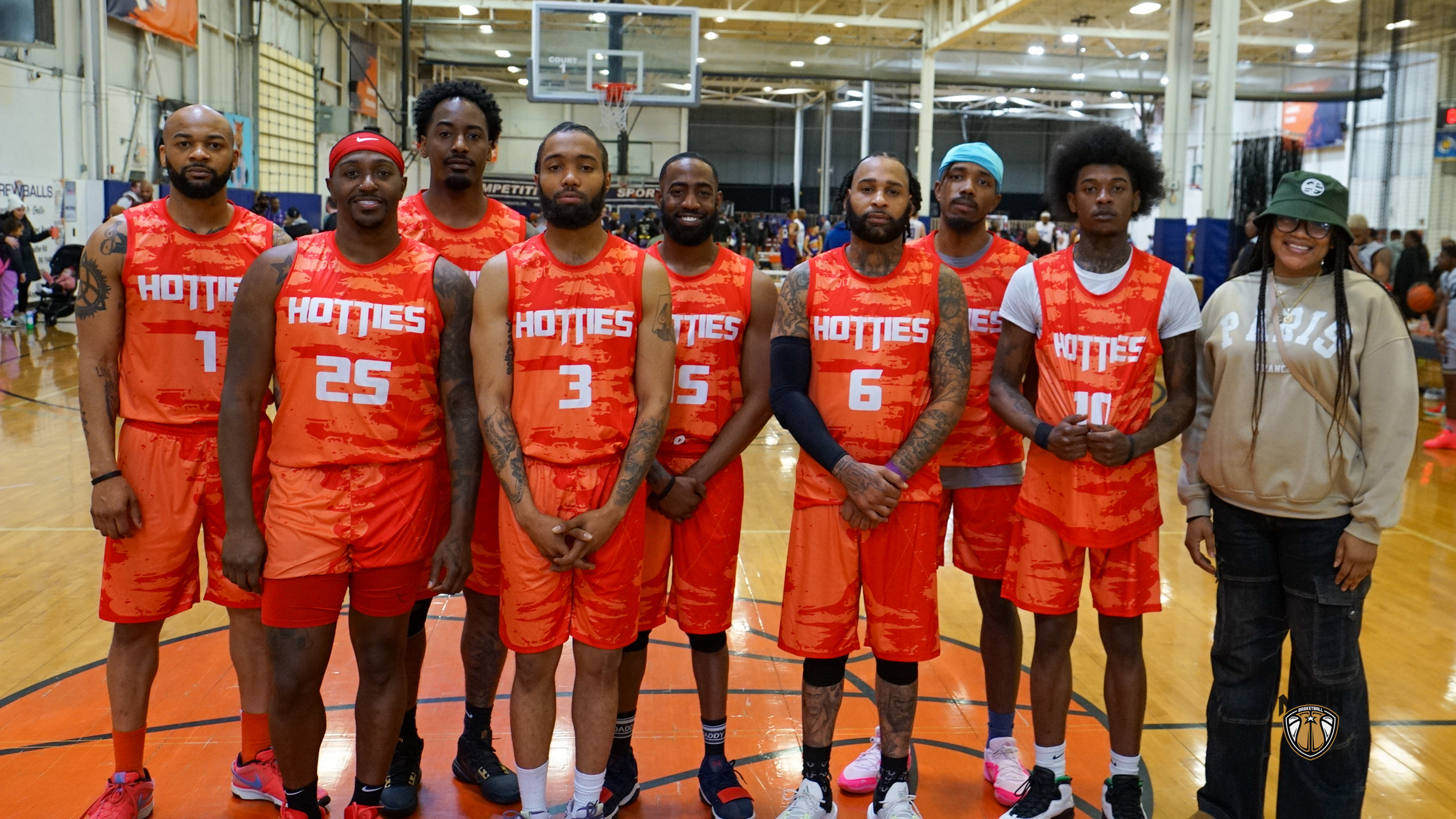 A basketball team poses for a group photo