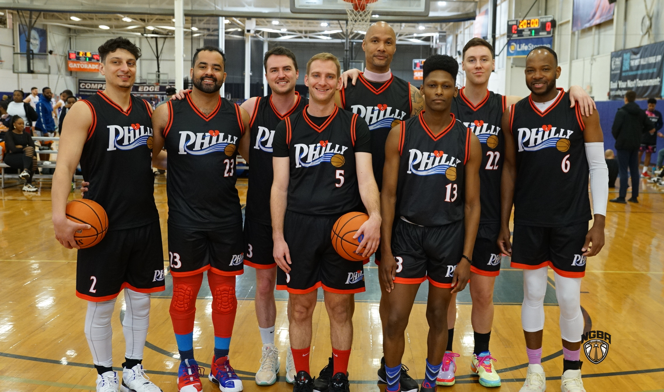 A basketball team poses for a group photo