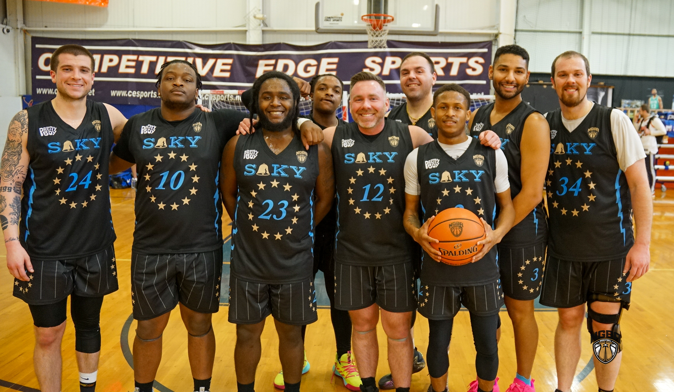 A basketball team poses for a group photo