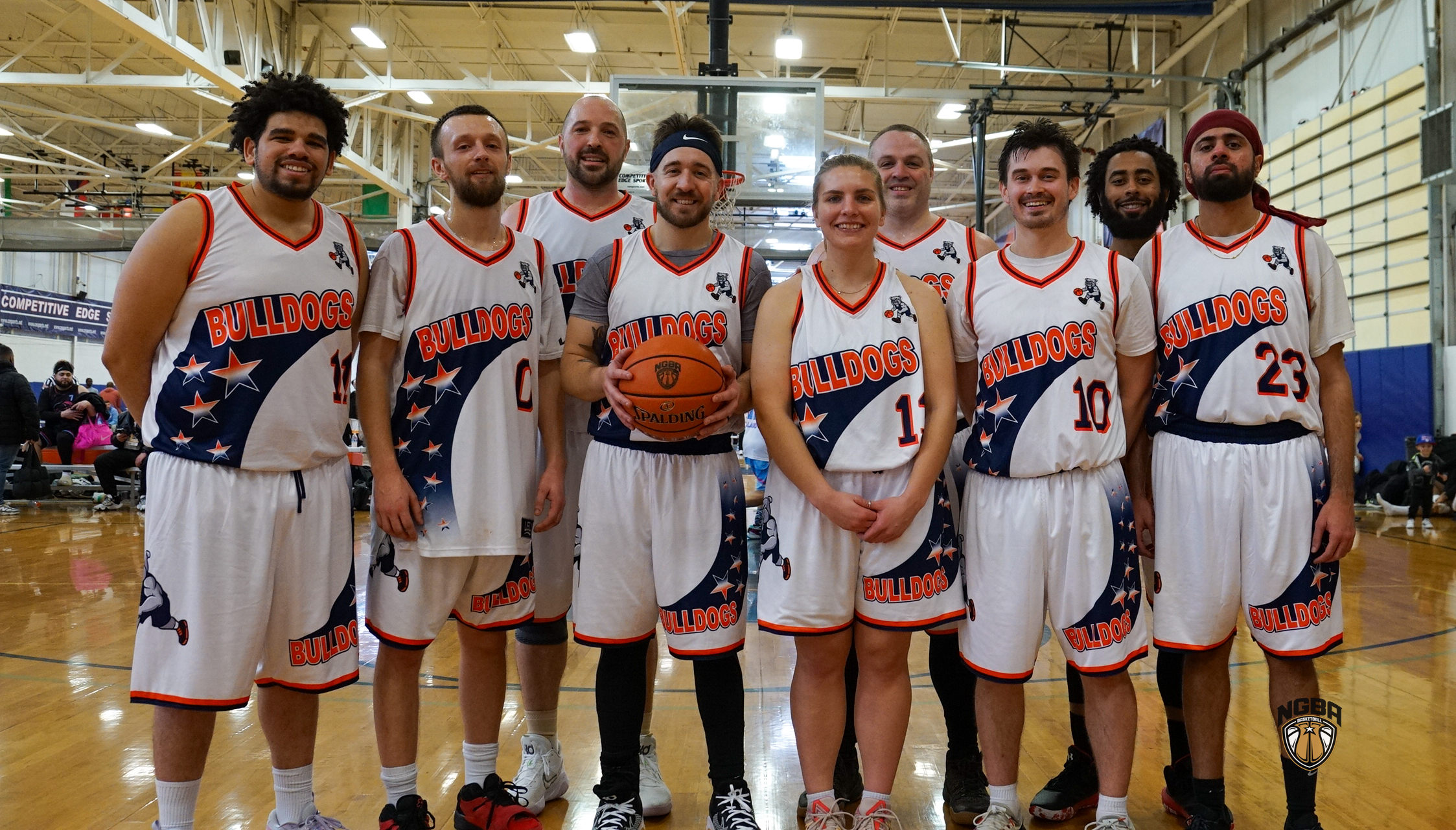 A basketball team poses for a group photo