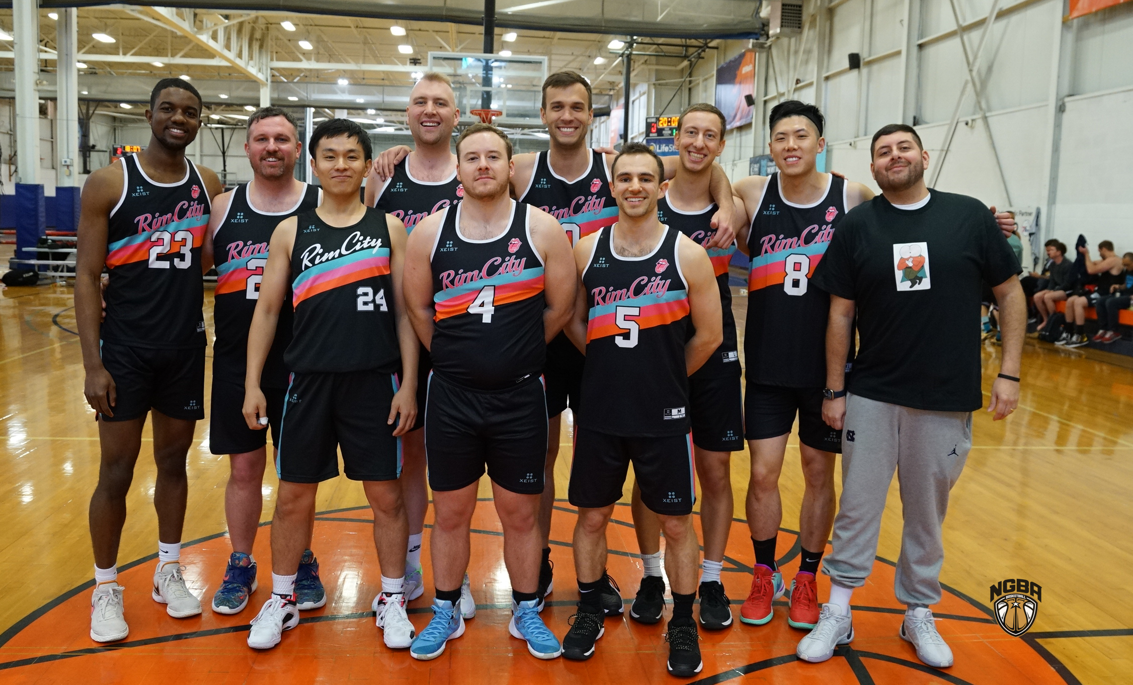 A basketball team poses for a group photo