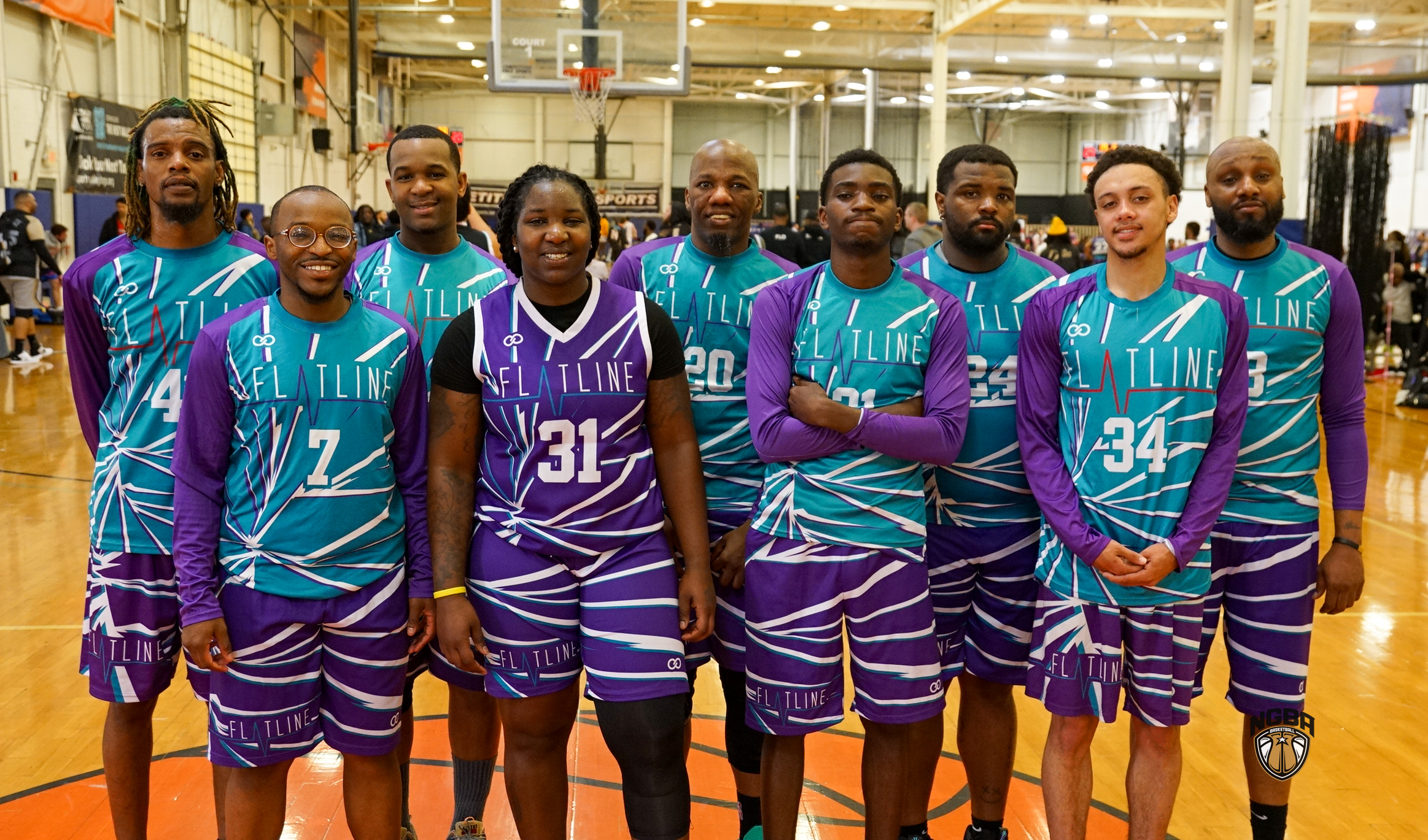 A basketball team poses for a group photo