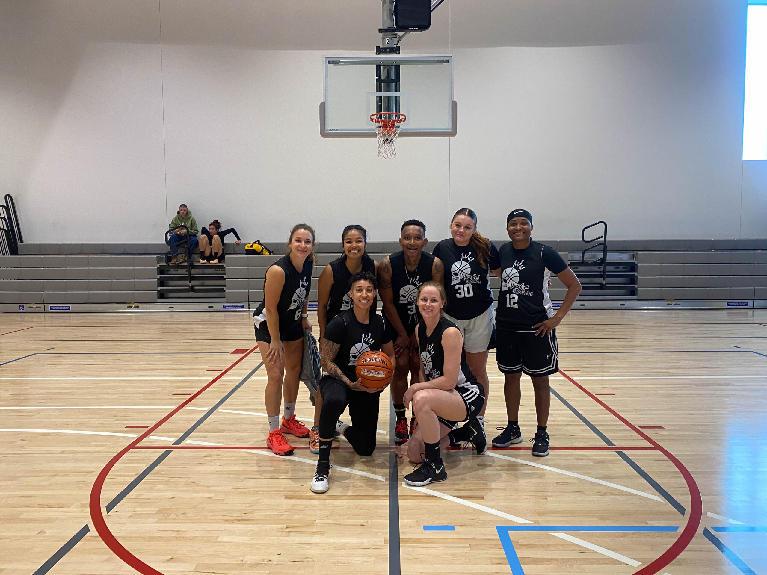 7 Women's+ players pose for a group photo